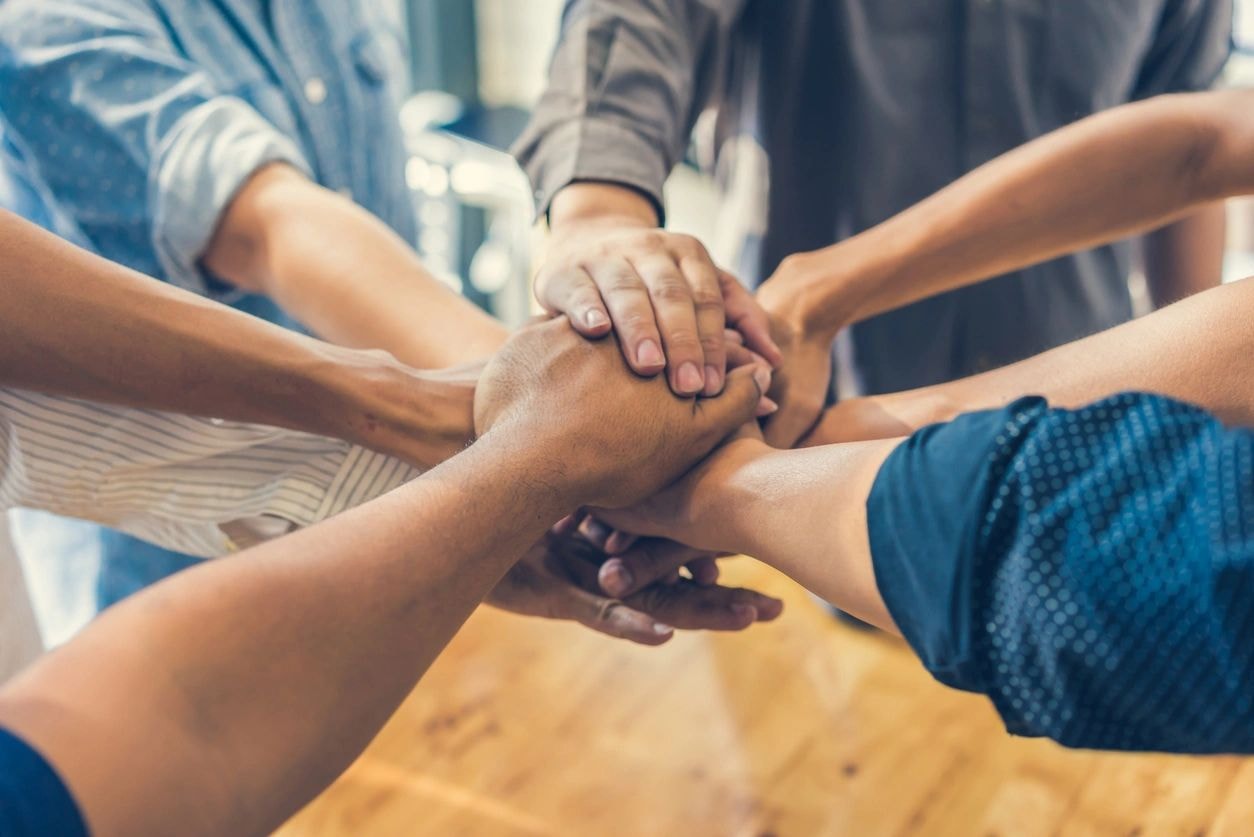 Team hands joined together